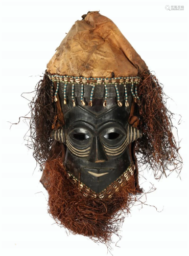 Wooden ceremonial mask with beads
