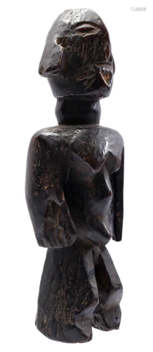 Wooden ceremonial statue of a standing woman