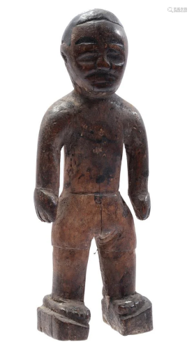 Wooden ceremonial statue of a standing man
