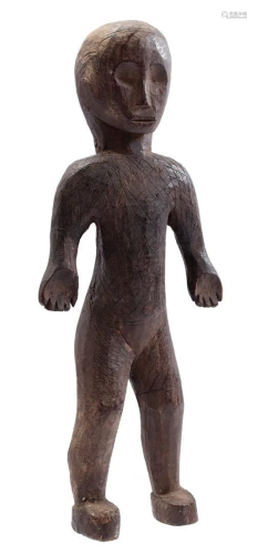Wooden ceremonial statue of a standing person