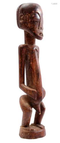 Wooden ceremonial statue of a man
