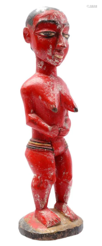 Red colored wooden ceremonial statuette