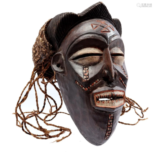 Wooden ceremonial mask decorated with flax