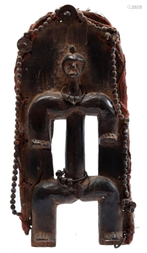 Wooden ceremonial shield with figure