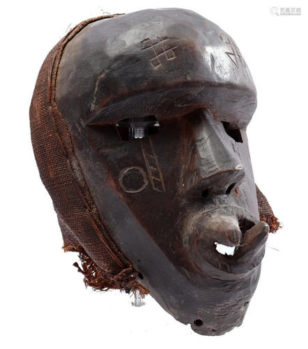 Wooden ceremonial mask with flax