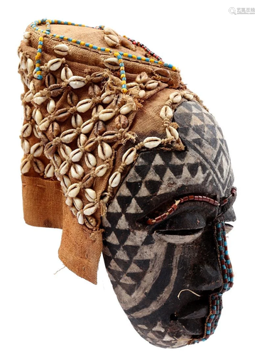 Wooden ceremonial mask with beads and shells