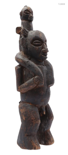 Wooden ceremonial statue of a standing man