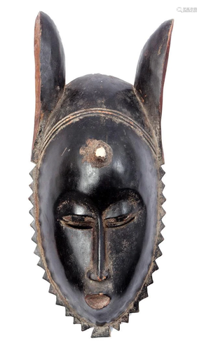 Wooden ceremonial mask with long ears