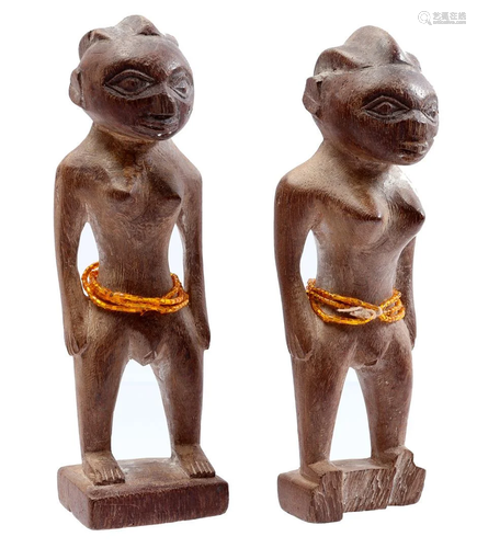 2 wooden ceremonial figurines of women