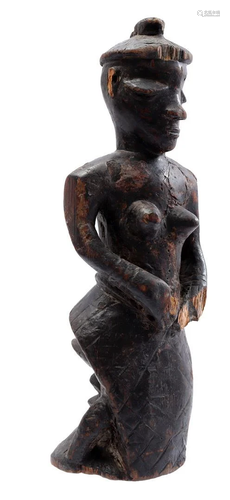 Wooden ceremonial statue of a kneeling woman