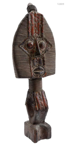 Wooden ceremonial figurine decorated with copper