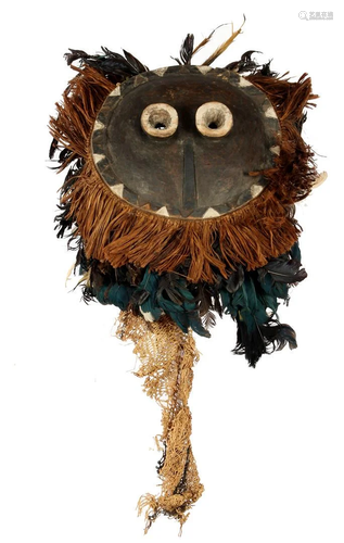 Wooden ceremonial mask with flax