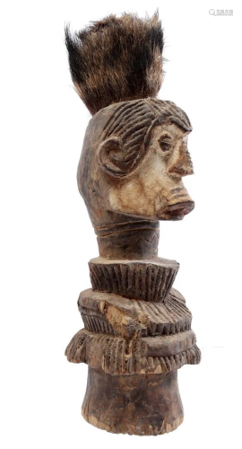Wooden ceremonial statue decorated with hair