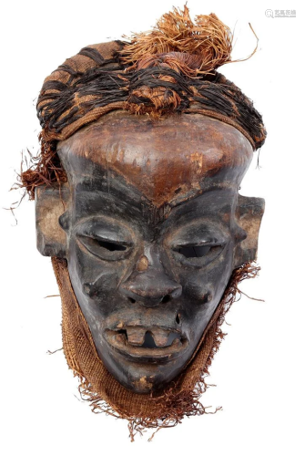 Wooden ceremonial mask with covering