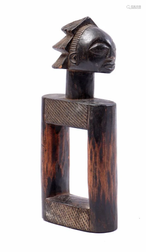 Ceremonial wooden figurine with face