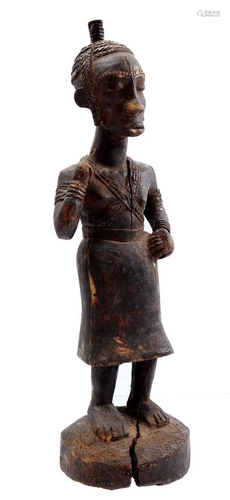 Wooden ceremonial statue of a standing person