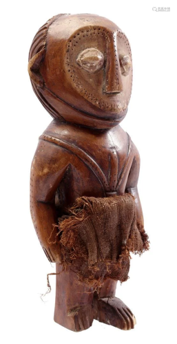 Wooden ceremonial statue decorated with flax