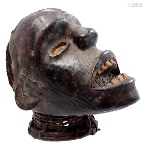 Wooden ceremonial Boki mask decorated with animal skin