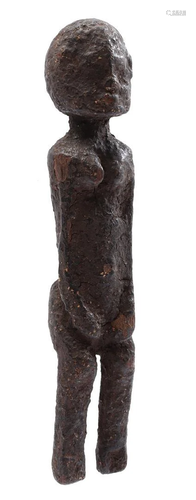 Wooden ceremonial figurine decorated with earth