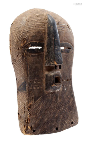 Wooden ceremonial mask with nose hair