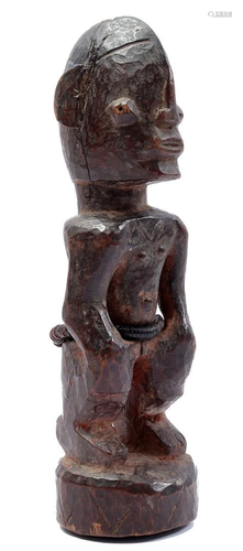 Wooden ceremonial statue with black beaded chain