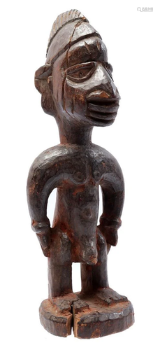 Wooden ceremonial statuette of a standing man