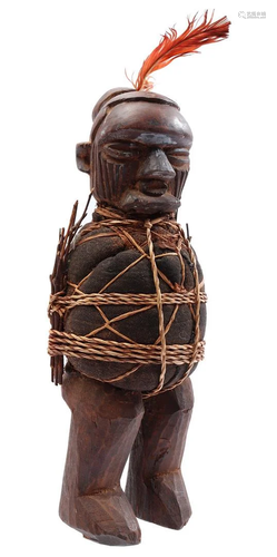 Wooden bound ceremonial figurine with textile