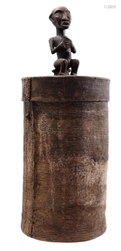 Wooden storage jar with lid with figure on top