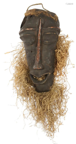 Wooden ceremonial mask with copper