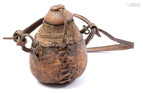 African jug with carrying strap with leather