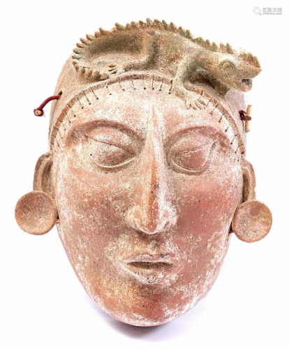 Earthenware mask of figure with reptile on head