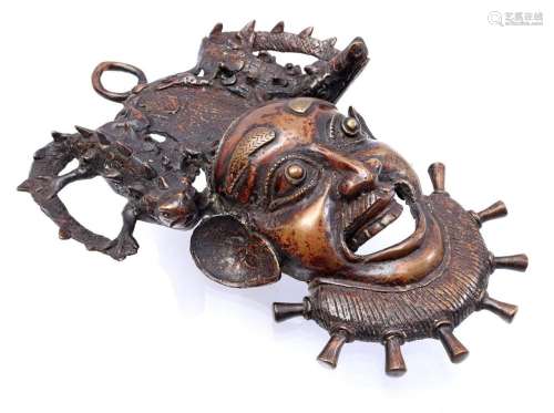 Bronze mask of figure with crocodiles