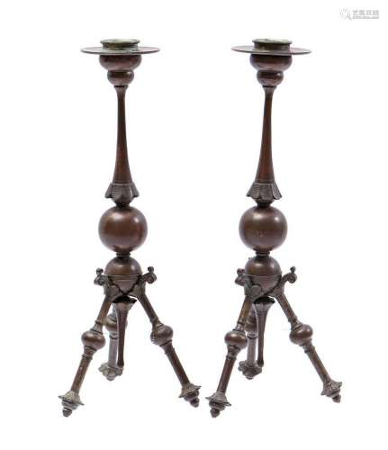 2 bronze table candlesticks on decorated 3-leg