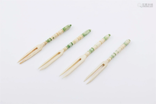 A SET OF BONE CARVING OF FRUIT PICKS