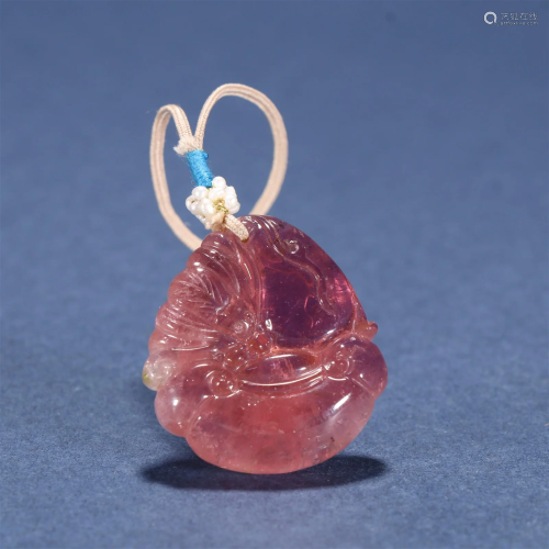 A Delicate Carved Tourmaline Pendant