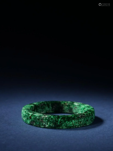A Rare Carved Jadeite Bracelet