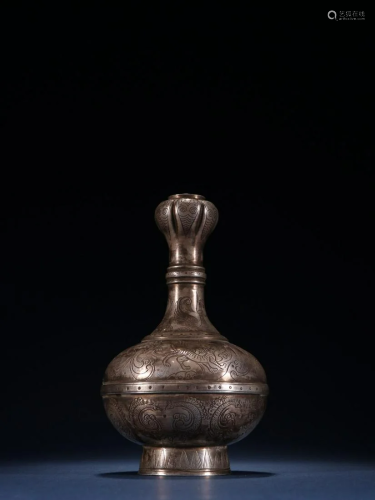 A Silver Garlic Bottle With Flower Pattern