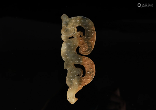 A Delicate Carved Jade Dragon Pendant