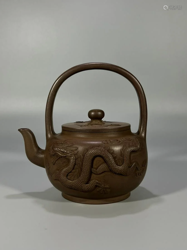 A Fine Zisha Teapot With Dragon and Phoenix Pattern