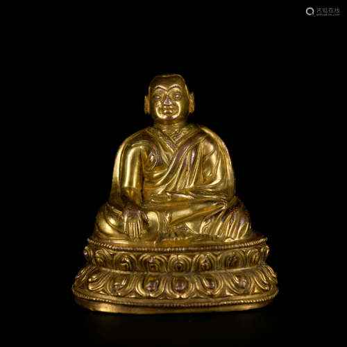 A gilt-bronze statue of Guru