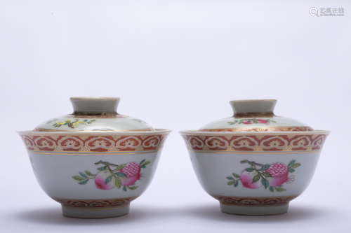 A pair of famille-rose 'peach' bowl and cover