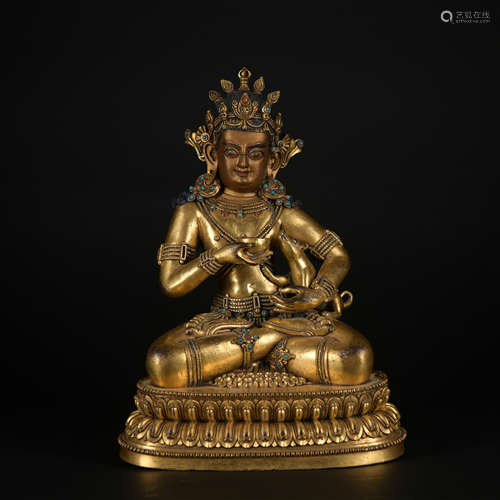 A gilt-bronze statue of Mammon