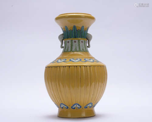 A yellow glazed vase