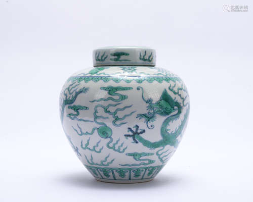 A green glazed 'dragon' jar and cover