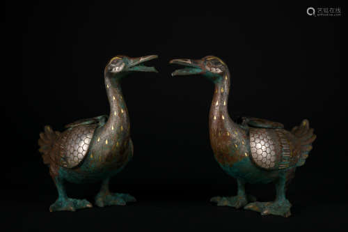 A pair of bronze duck ware with gold and silver