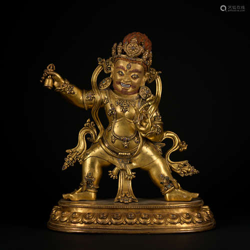 A gilt-bronze statue of Mammon