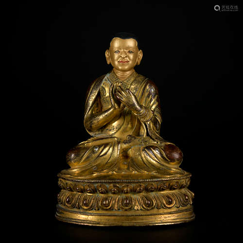 A gilt-bronze statue of Guru