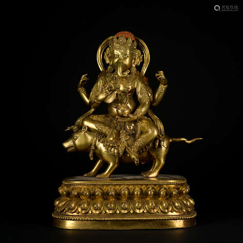 A gilt-bronze statue of GANESH