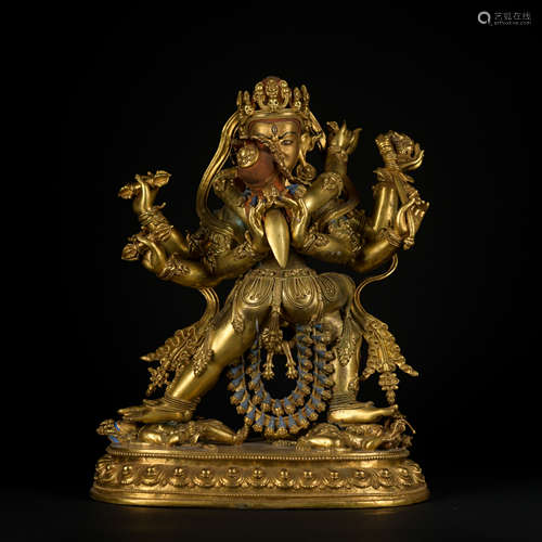 A gilt-bronze statue of Guhyasamaja