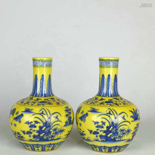 A Lemon Yellow Blue and White Flowers Spherical Bottle